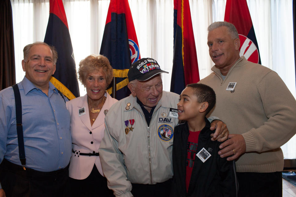 This is three generations of this man’s family, him and his wife, their sons (or inlaws) and a grandson. Credit: United States Holocaust Memorial Museum.