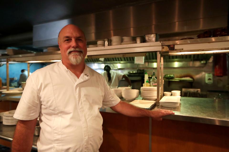 Kevin Stout, executive chef at Food Glorious Food, poses for a photo in front of the kitchen Saturday, Aug. 10, 2019. 