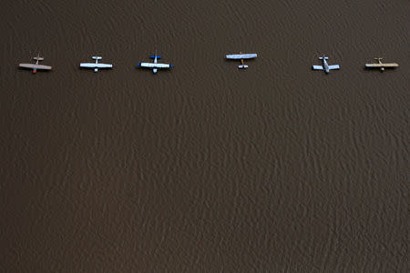 FILE PHOTO: Planes are surrounded by flood waters caused by Tropical Storm Harvey at the West Houston Airport in Texas, U.S. August 30, 2017. REUTERS/Adrees Latif/File Photo