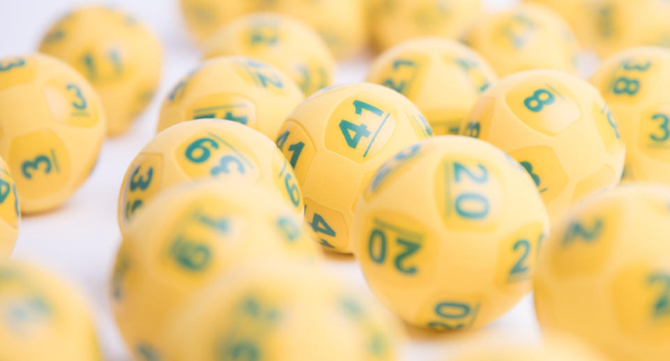 Photo shows several Oz Lotto balls. 