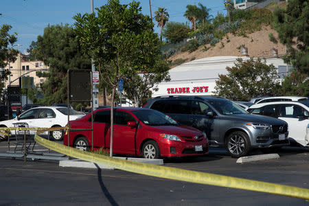 A police tape cordons off a parking lot across the street from a Trader Joe's store where a hostage situation unfolded in Los Angeles, California, July 21, 2018. REUTERS/Andrew Cullen