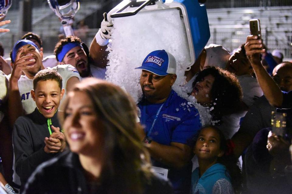 Atwater High football players dump an ice bucket on Falcons head coach Seneca Ybarra after Atwater’s 42-39 win in the 50th Santa Fe Bowl. The victory snapped a nine-game losing streak to Merced. Shawn Jansen/Sjansen@mercedsun-star.com