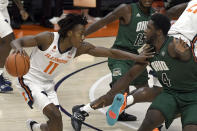 Illinois' Ayo Dosunmu (11) pushes past Ohio's forward Dwight Wilson III (4) during the first half of an NCAA college basketball game Friday, Nov. 27, 2020, in Champaign, Ill. (AP Photo/Holly Hart)