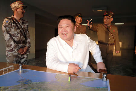 North Korean leader Kim Jong Un reacts during a ballistic rocket test-fire through a precision control guidance system in this undated photo released by North Korea's Korean Central News Agency (KCNA) May 30, 2017. KCNA/via REUTERS