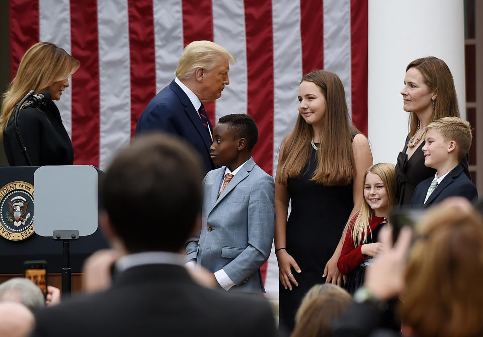 President Donald Trump with Judge Amy Coney Barrett as she and some of her children gather in the Rose Garden of the White House on Sept. 26, 2020. (Photo: OLIVIER DOULIERY via Getty Images)