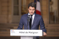 French Prime Minister Gabriel Attal delivers a speech in the courtyard of the Prime Minister's residence, Sunday, June 30, 2024 in Paris. France's high-stakes legislative elections propelled the far-right National Rally to a strong but not decisive lead in the first-round vote Sunday, polling agencies projected, dealing another slap to centrist President Emmanuel Macron. (AP Photo/Thomas Padilla)