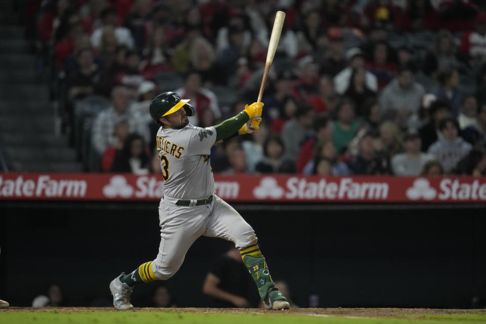 Oakland Athletics' Shea Langeliers (23) hits a home run during the eighth inning of a baseball game against the Los Angeles Angels in Anaheim, Calif., Saturday, Sept. 30, 2023. Ryan Noda and Zack Gelof also scored. (AP Photo/Ashley Landis)