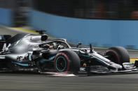 Mercedes driver Lewis Hamilton of Britain steers his car during the qualifying round for the Singapore Formula One Grand Prix at the Marina Bay City Circuit in Singapore, Saturday, Sept. 21, 2019. (AP Photo/Vincent Thian)