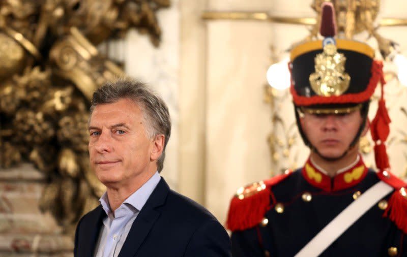 Argentina's President Mauricio Macri (L) arrives for a news conference at the Casa Rosada Presidential Palace in Buenos Aires, Argentina October 23, 2017. REUTERS/Marcos Brindicci