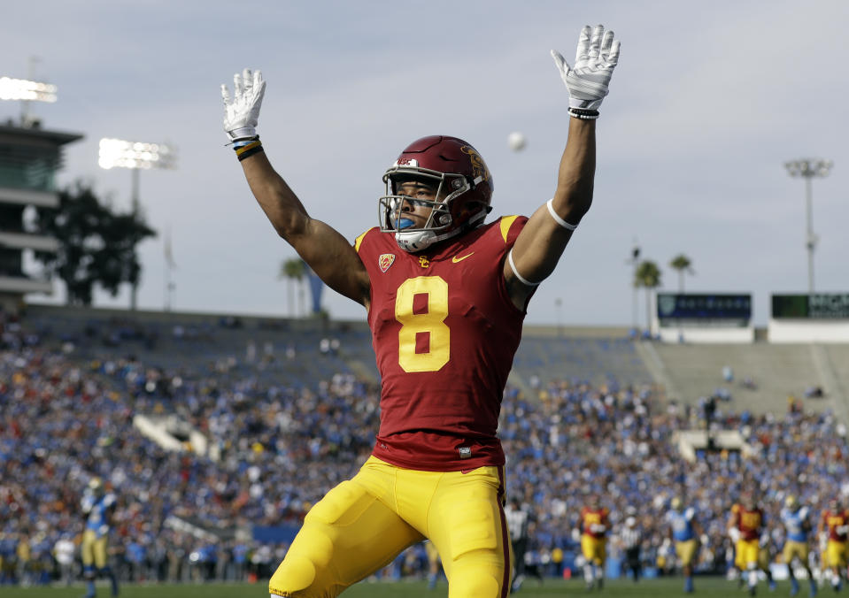 Southern California wide receiver Amon-Ra St. Brown (8) raises his arms after a touchdown reception against UCLA during the first half of an NCAA college football game Saturday, Nov. 17, 2018, in Pasadena, Calif. (AP Photo/Marcio Jose Sanchez)