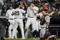 New York Yankees' Aaron Judge, center, and Gleyber Torres (25) celebrate after Torres' three-run home run during the fifth inning of the second game of a baseball doubleheader against the Baltimore Orioles, Monday, Aug. 12, 2019, in New York. (AP Photo/Frank Franklin II)