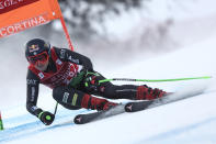 Italy's Sofia Goggia speeds down the course on her way to win an alpine ski, women's World Cup downhill race, in Cortina d'Ampezzo, Italy, Friday, Jan. 20, 2023. (AP Photo/Gabriele Facciotti)