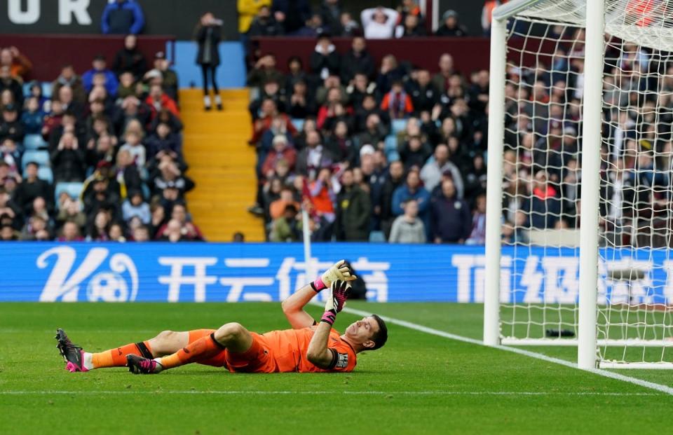 Aston Villa goalkeeper Emiliano Martinez lies dejected during the Premier League match at Villa Park, Birmingham. (PA)