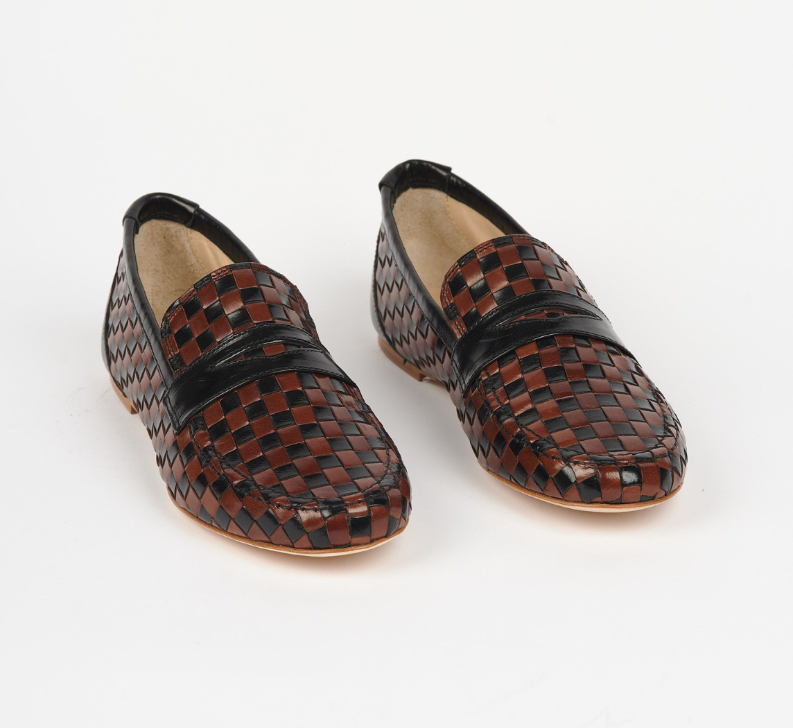 <p><a href="https://pierceandward.com/collections/pw-x-jamie-haller/products/jamie-haller-x-pw-woven-loafer-black-brown" rel="nofollow noopener" target="_blank" data-ylk="slk:Shop Now;elm:context_link;itc:0;sec:content-canvas" class="link rapid-noclick-resp">Shop Now</a></p><p>Woven Loafer Black / Brown</p><p>$595.00</p><p>pierceandward.com</p>