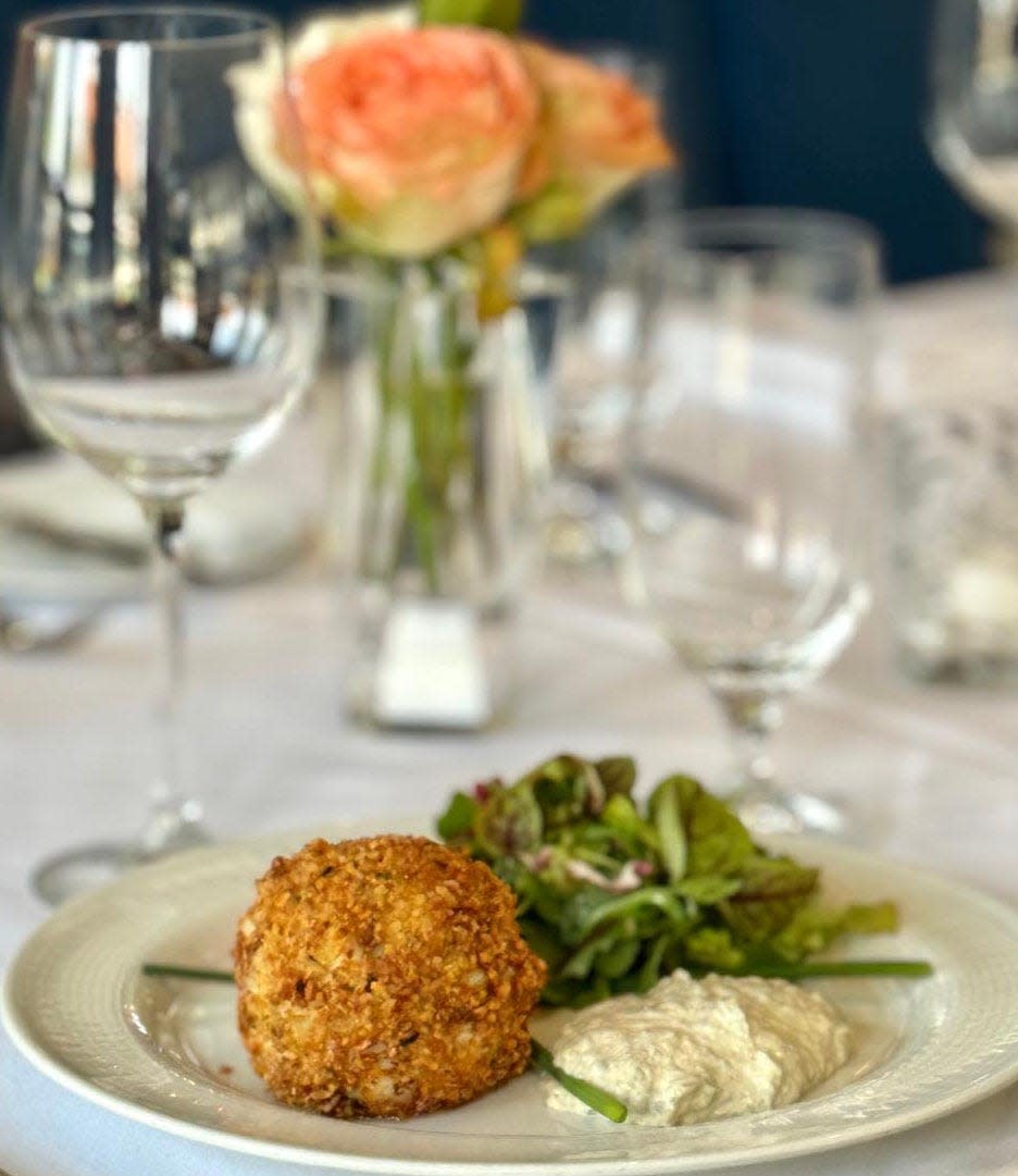 Crab cakes at Cafe L'Europe have a unique origin.