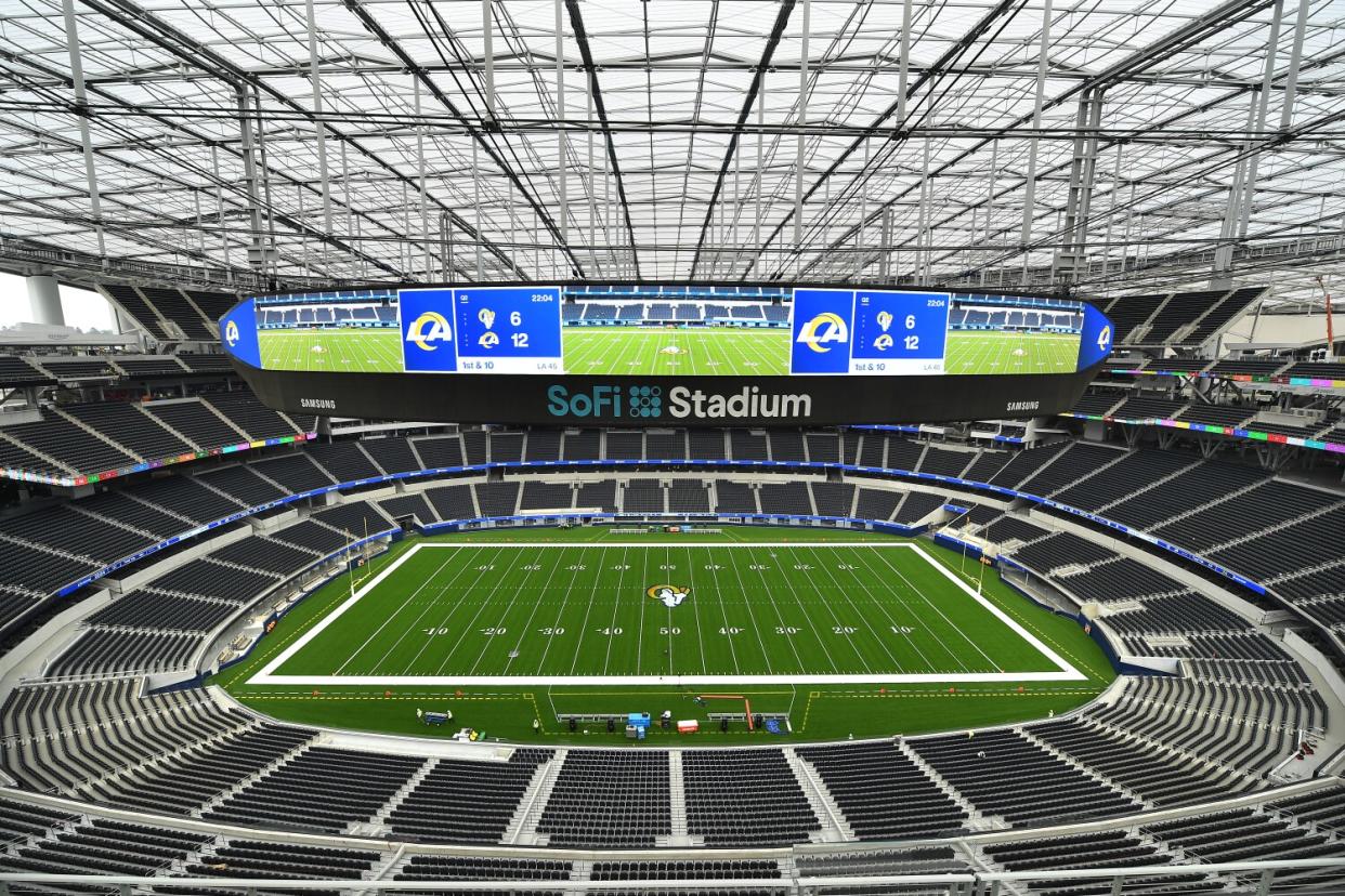 A view of SoFi Stadium's playing field from the upper stands shows clean lines of sight and the jumbotron.