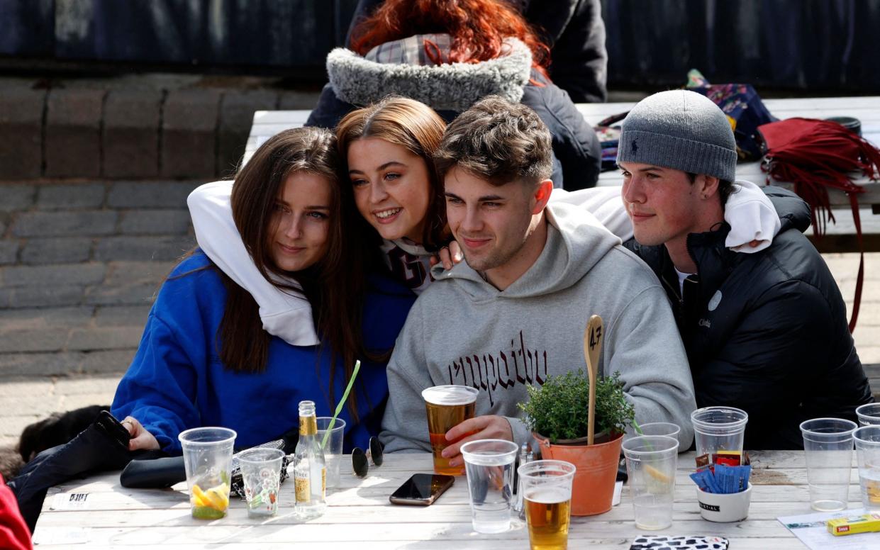 Friends drinking in the garden of the Angel on the Bridge pub Henley-on-Thames - Adrian Dennis/AFP via Getty Images