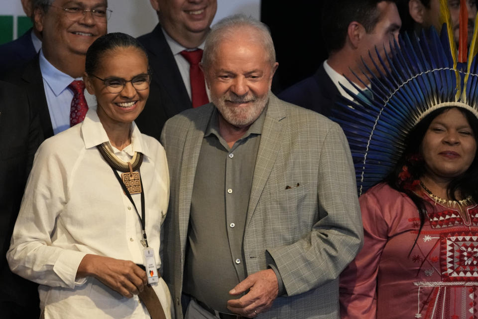 FILE - Brazil's President-elect Luiz Inacio Lula da Silva and his newly-named Environment Minister Marina Silva, left, smile during a meeting where he announced ministers for his incoming government in Brasilia, Brazil, Dec. 29, 2022. At right is Minister of Indigenous Peoples Sonia Guajajara. In a rejection of early moves by Lula who took office in January 2023, Brazil’s Congress on June 1, 2023 stripped powers from the new Ministry of Indigenous Peoples and Ministry of the Environment and Climate Change, both led by women environmentalists, Silva and Guajajara. (AP Photo/Eraldo Peres, File)