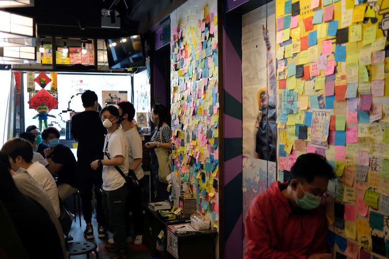 FILE PHOTO: Customers sit inside a yellow restaurant called ''Mainichi'', during ''golden ween'' holiday by supporting local businesses with the pro-democracy views, in Hong Kong