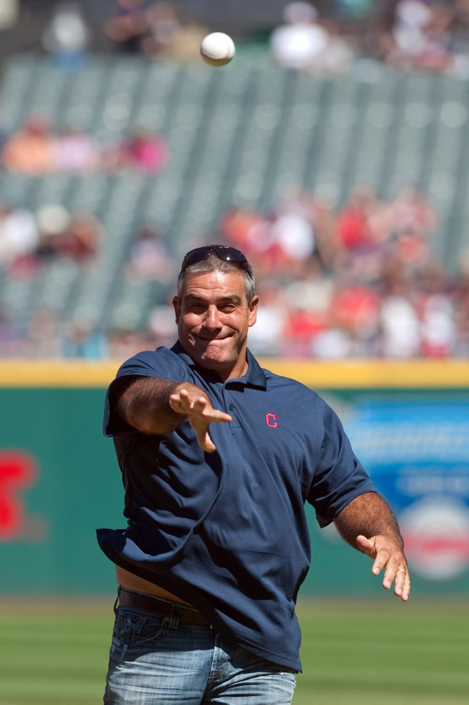 Former pitcher Chad Ogea throws out a ceremonial first pitch before Cleveland's home game against the Chicago White Sox, Sept. 7, 2014.