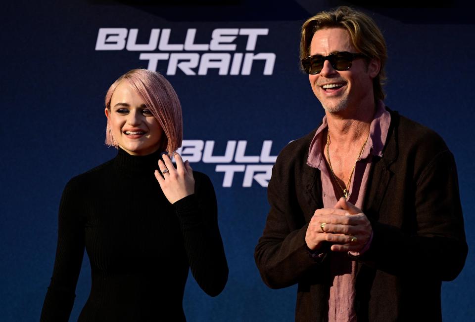 US actor Brad Pitt (R) poses for a photo on the red carpet with US actress Joey King at a preview of the film Bullet Train at the Zoo Palast cinema in Berlin on July 19, 2022. (Photo by John MACDOUGALL / AFP) (Photo by JOHN MACDOUGALL/AFP via Getty Images)