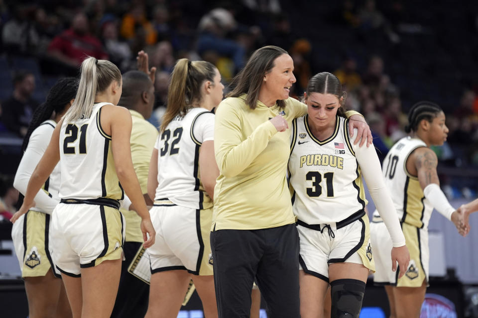 Purdue head coach Katie Gearlds talks with guard Sophie Swanson (31) during the second half of an NCAA college basketball game against Northwestern at the Big Ten women's tournament Wednesday, March 6, 2024, in Minneapolis. (AP Photo/Abbie Parr)