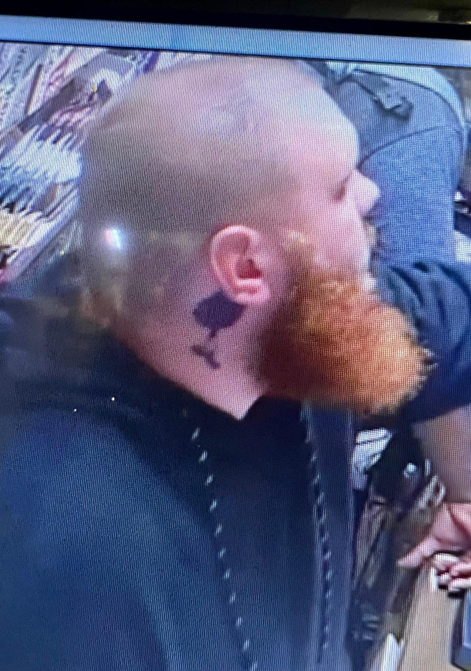 This view shows a tattoo below the right ear of one of the suspects in a fatal carjacking that took place early Saturday morning, Sept. 2, 2023, in the 1000 block of East Front Street.