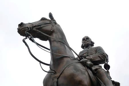 The statue of Confederate general and early member of the Ku Klux Klan (KKK), Nathan Bedford Forrest, stands over his grave in Health Sciences Park in Memphis, Tennessee, U.S. August 17, 2017. REUTERS/Karen Pulfer Focht/Files