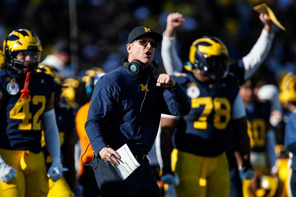 Michigan coach Jim Harbaugh reacts to a play against Alabama during the first half of the Wolverines' 27-20 overtime win.