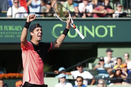 Mar 24, 2018; Key Biscayne, FL, USA; Thanasi Kokkinakis of Australia celebrates after match point against Roger Federer of Switzerland (not pictured) on day five of the Miami Open at Tennis Center at Crandon Park. Kokkinakis won 3-6, 6-3, 7-6(4). Mandatory Credit: Geoff Burke-USA TODAY Sports