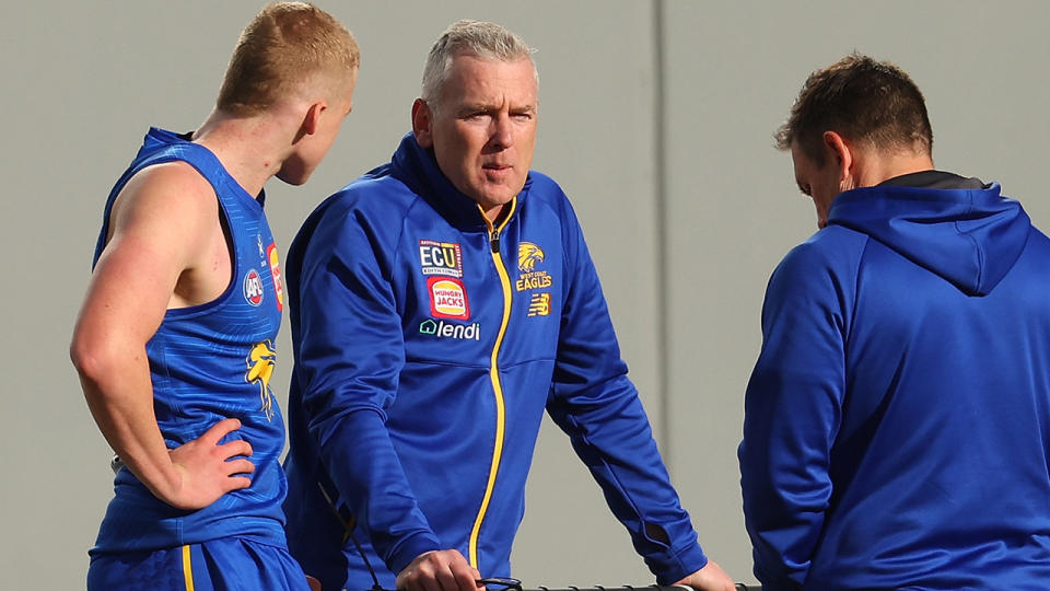 Adam Simpson speaks with players at a West Coast Eagles training session.