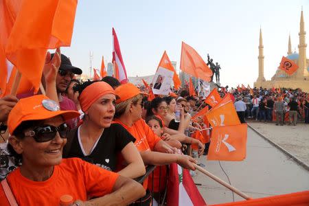 Supporters of the Free Patriotic Movement (FPM) carry flags during a protest in Beirut, Lebanon, September 4, 2015. REUTERS/Aziz Taher