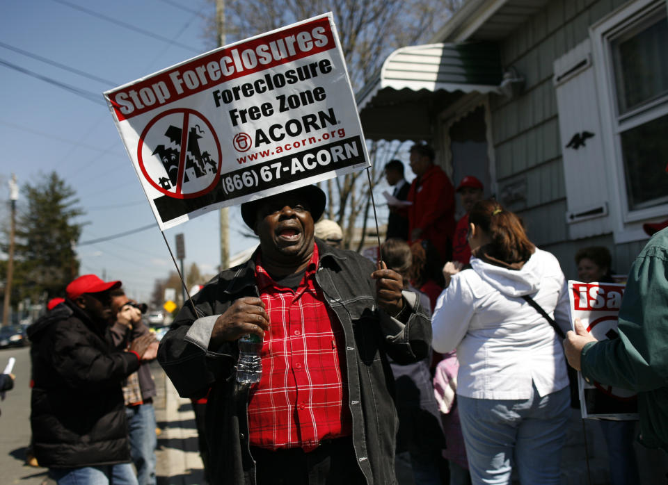 Demonstrators from ACORN's Home Defenders rally outside the foreclosed home of Marie Elie in Elmont, New York, April 9, 2009. (REUTERS/Shannon Stapleton)