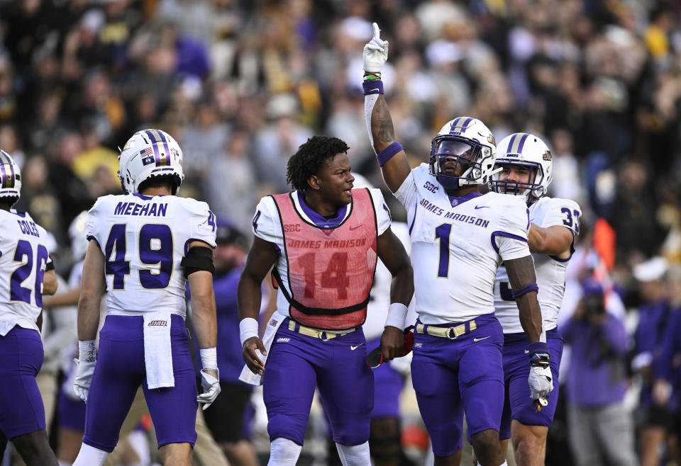 BOONE, NORTH CAROLINA - SEPTEMBER 24: Que Reid #1 of the James Madison Dukes celebrates after helping stop an Appalachian State Mountaineers 4th down in the fourth quarter at Kidd Brewer Stadium on September 24, 2022 in Boone, North Carolina. (Photo by Eakin Howard/Getty Images)