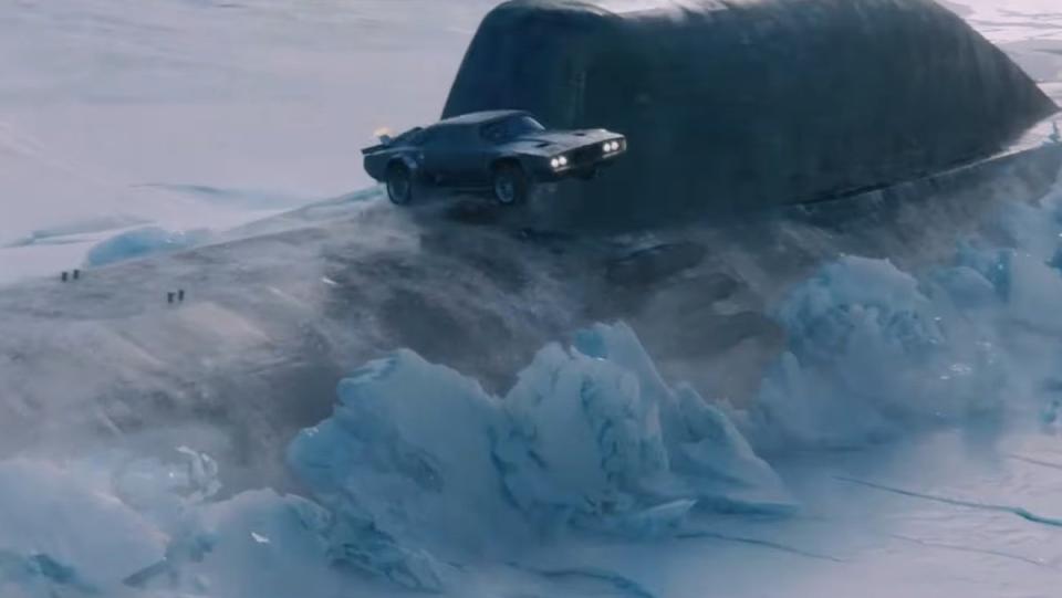 A car jumping in front of a submarine emerging from the ice in Fast & Furious 8