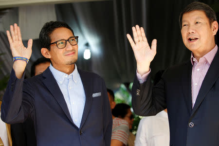 Sandiaga Uno (L), who is the vice-presidential candidate for Prabowo Subianto, and legal team director for Prabowo-Sandi National Campaign Team (BPN), Hashim Djojohadikusumo wave after delivering a media briefing about taking the election result for a constitutional court challenge, in Jakarta, Indonesia, May 24, 2019. REUTERS/Willy Kurniawan