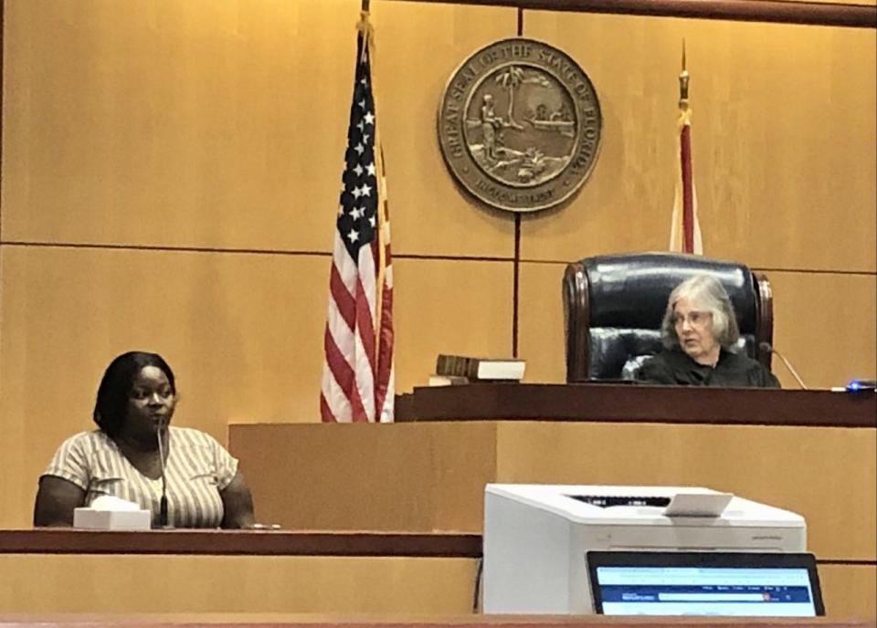 Makita Lucas, left, sister of accident victim Passion Lucas, testifies during a sentencing hearing Friday for Suzanna Norris. At right is Brevard County Judge Judy Atkin.