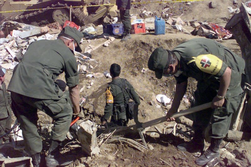 Members of the Mexican army take part in search and rescue operations in the hills of Santa Tecla, New El Salvador, where more than 250 houses were destroyed during an earthquake on January 13, 2001. File Photo by Alejandro Ancona/Notimex