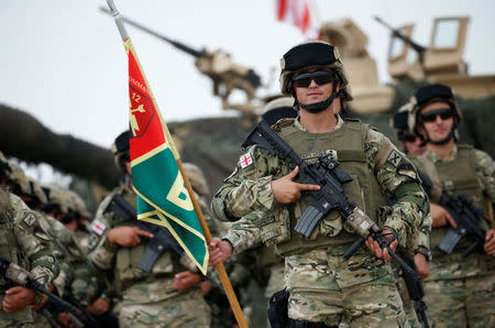 Georgian servicemen stand at attention during an opening ceremony of the NATO-led military exercises "Noble Partner 2018" at Vaziani military base outside Tbilisi, Georgia, August 1, 2018. REUTERS/David Mdzinarishvili