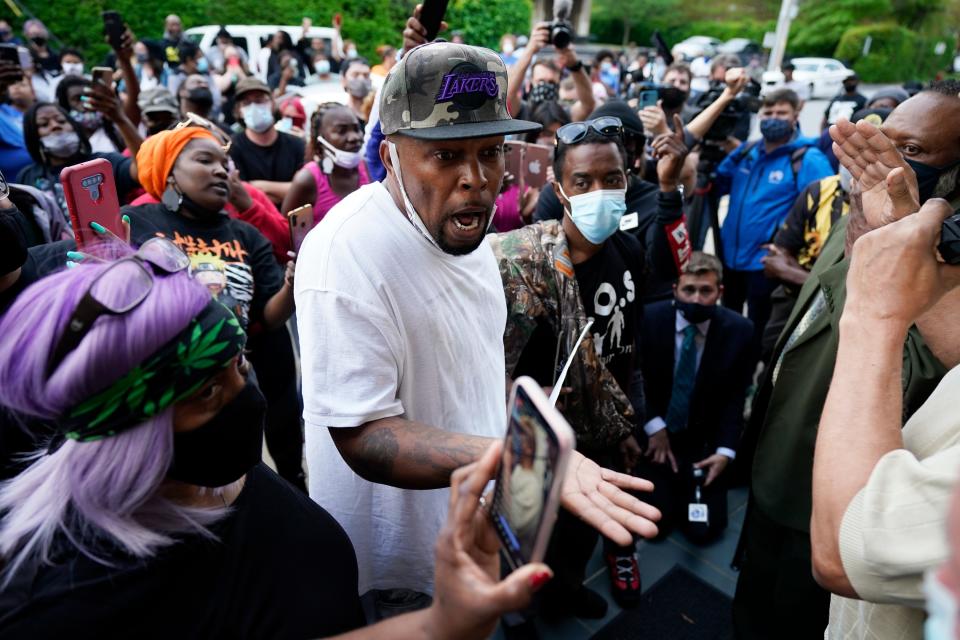 Protesters gather outside the Pasquotank County 
municipal building in North Carolina on Wednesday after at least one sheriff's deputy shot and killed a Black man while executing a search warrant in Elizabeth City.