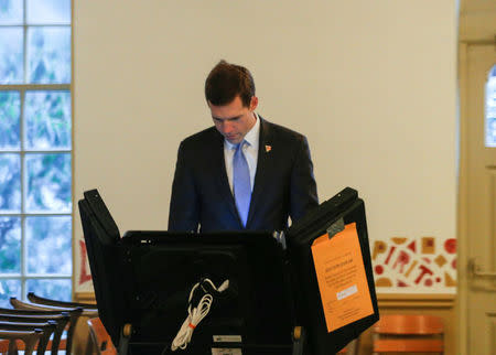 Democratic congressional candidate Conor Lamb fills out his ballot to vote in Mt. Lebanon, Pennsylvania, U.S., March 13, 2018. REUTERS/Brendan McDermid