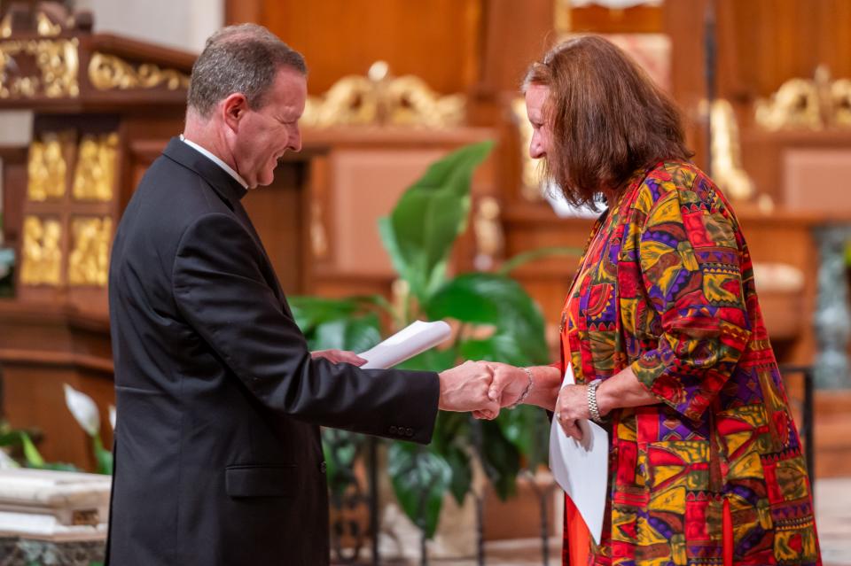 Bishop Erik T. Pohlmeier thanks Dr. Mary Soha for her lecture on the life of St. Augustine, the Bishop of Hippo. The Diocese of St. Augustine celebrated solemn vespers on the feast day of St. Augustine, the Bishop of Hippo, August 28, 2023. The City of St. Augustine was dedicated to him when it was founded by Pedro Menéndez on the saint's feast day in 1565. The statue of St. Augustine was recently installed in the Cathedral Basilica of St. Augustine and was a gift to the cathedral in 2021 by former rector, Very Rev. Thomas Willis.
Picture made August 28, 2023.
[Fran Ruchalski for the St. Augustine Record]