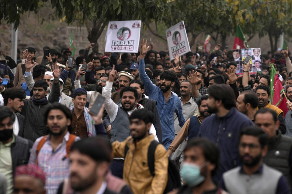 Supporters of former Pakistani Prime Minister Imran Khan chant slogans outside a court, where their leader Khan appeared, in Islamabad, Pakistan, Tuesday, Feb. 28, 2023. A Pakistani court approved bail for Khan after he appeared before a judge in Islamabad amid tight security, officials said, months after police filed terrorism charges against the country's popular opposition leader for inciting people to violence. (AP Photo/Anjum Naveed)