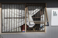 Police forensic staff work inside a mosque in Auckland, New Zealand, Saturday, Sept. 4, 2021. New Zealand authorities say they shot and killed a violent extremist, Friday Sept. 3 after he entered a supermarket and stabbed and injured six shoppers. Prime Minister Jacinda Ardern described Friday's incident as a terror attack. (AP Photo/Brett Phibbs)