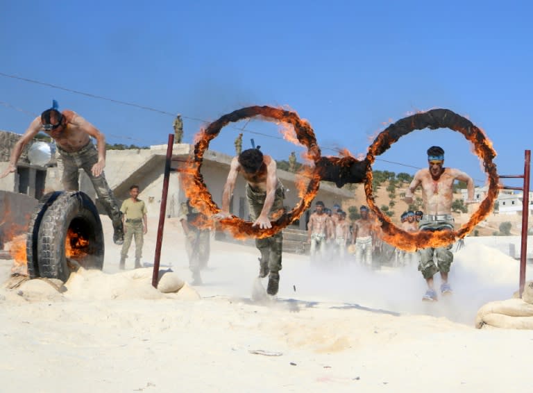 Syrian rebel fighters from the National Liberation Front undergo military training in Idlib province on September 1, 2018