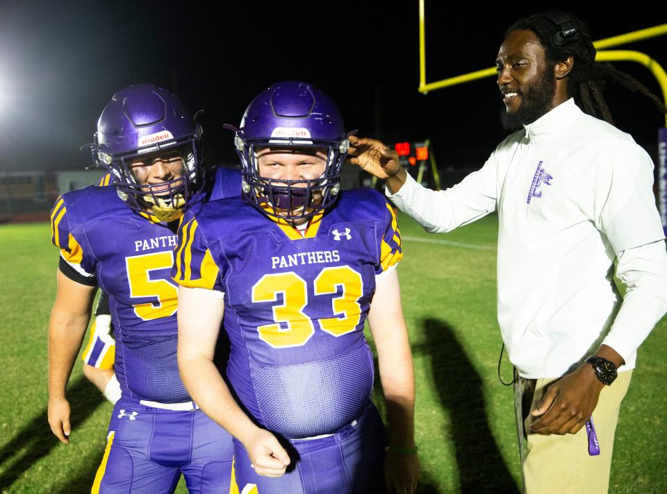 Cypress Lake High School student, Peyton Melton, center, celebrates after a touchdown in a pre-arranged extra play against Fort Myers High School on Friday, Oct. 27, 2023. The special needs student is a big sports fan and supporter of the football team.