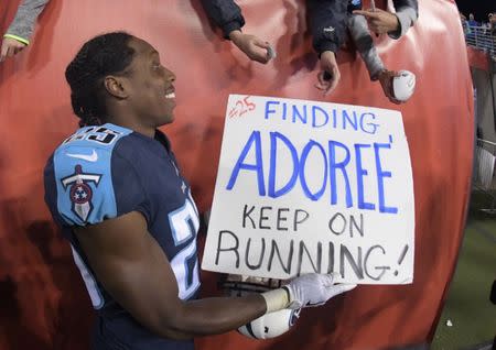 Oct 16, 2017; Nashville, TN, USA; Tennessee Titans cornerback Adoree' Jackson (25) holds a sign that reads "Finding Adoree...Keep on running!" after a game against the Indianapolis Colts at Nissan Stadium. The Titans defeated the Colts 36-22. Mandatory Credit: Kirby Lee-USA TODAY Sports