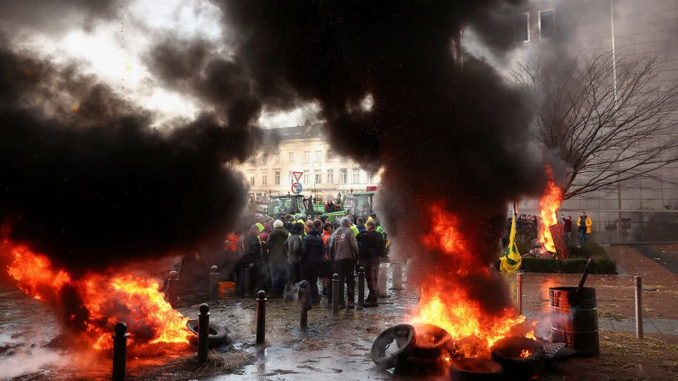 Some of the protesters set objects on fire in front of the parliament building. - Yves Herman/Reuters