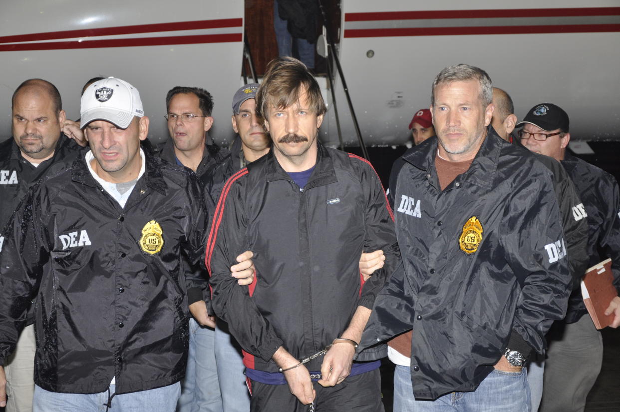 WHITE PLAINS, NY - NOVEMBER 16:  In this photo provided by the U.S. Department of Justice, former Soviet military officer and arms trafficking suspect Viktor Bout (C) deplanes after arriving at Westchester County Airport November 16, 2010 in White Plains, New York. Bout was extradited from Thailand to the U.S. to face terrorism charges after a final effort by Russian diplomats to have him released failed. (Photo by U.S. Department of Justice via Getty Images)