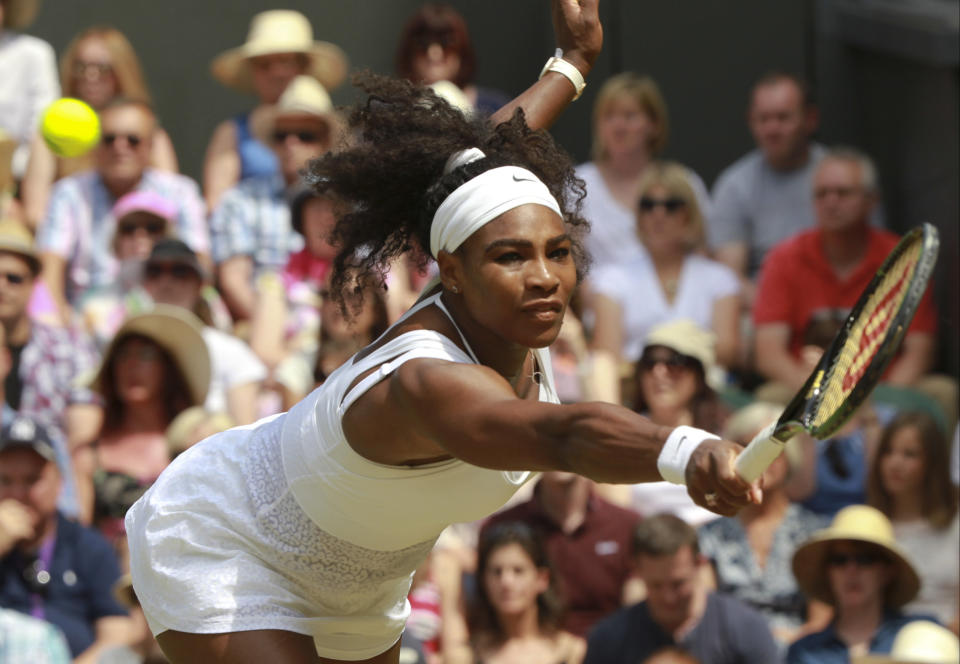 Serena Williams of the United States returns a shot to Garbine Muguruza of Spain during the women's singles final at the All England Lawn Tennis Championships in Wimbledon, London, Saturday July 11, 2015. (Sean Dempsey/Pool Photo via AP)